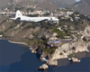A P-3c Orion Aircraft Assigned To The Tigers Of Patrol Squadron Eight (vp-8) Flies Along The Coastline Of Taormina, Sicily. Clip Art