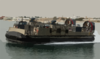 Lcac Departs From A Large Cement Parking Pad On A Beach Clip Art