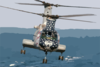 An Ch-46 Sea Knight Helicopter Assigned To Helicopter Combat Support Squadron Eleven (hc 11) Prepares To Pick Up Sling Loaded Cargo From The Fast Combat Support Ship Uss Camden (aoe 2). Clip Art