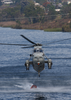 A Uh-3h Sea King Helicopter Loads Its Bambi Bucket Image