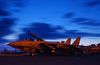 An F-14  Tomcat  Assigned To The  Swordsmen  Of Fighter Squadron Three Two (vf 32) Stands Ready For Evening Flight Operations Image