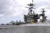 An F-14 Tomcat Fighter Catches The Arresting Wire On The Rain-soaked Flight Deck Aboard Uss Harry S. Truman (cvn 75) Image