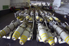 In The Hangar Bay Aboard Uss Nimitz (cvn 68), Ordnance Is Inspected Prior To Being Transported To The Ship S Flight Deck And Uploaded Onto Various Aircraft. Image