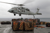 Storekeepers Assigned To The Aircraft Carrier Uss Kitty Hawk (cv 63) Supply Department S Stock Control Division, Hook Up Palletized Cargo To An Mh-60s Knighthawk Helicopter. Image
