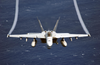 An F/a-18e Super Hornet Flies Over The Western Pacific Ocean During Flight Operations. Image