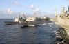 Uss Anzio (cg 68) Conducts An Underway Replenishment (unrep) At Sea Off The Starboard Side Of The Military Sealift Command Oiler Usns Arctic (t-aoe 8), While Theodore Roosevelt Conducts A Simultaneous Replenishment Image