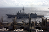 The Guided Missile Frigate Uss Ingraham (ffg 61) Sails Alongside The Fast Combat Support Ship Uss Sacramento (aoe 1) During An Under Way Replenishment That Includes The Aircraft Carrier Uss Carl Vinson (cvn 70) Image