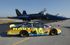The Navy Sponsored Chevrolet Monte Carlo Busch Series Race, Show Car Is Parked On The Tarmac Near F/a-18 Hornets Assigned To The Navy S Flight Demonstration Team, The Blue Angels, At Sherman Field Onboard Nas Pensacola. Image