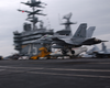 An F/a 18  Hornet   Assigned To The  Gunslingers  Of Strike Fighter Squadron One Zero Five (vfa-105), Performs A  Touch And Go  On The Ship S Flight Deck. Image