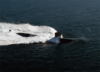 A Los Angeles Class Fast-attack Submarine Steams Along On The Surface Of The Pacific Ocean. Clip Art