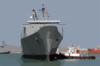 Tugboats Ease The Military Sealift Command (msc) Fast Sealift Ship Usns Bellatrix (t-akr 288) Into The Port Of Mina Ash-shu Clip Art